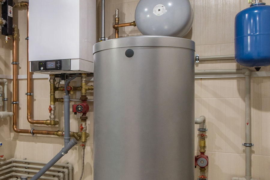 A modern boiler system with a cylindrical water heater